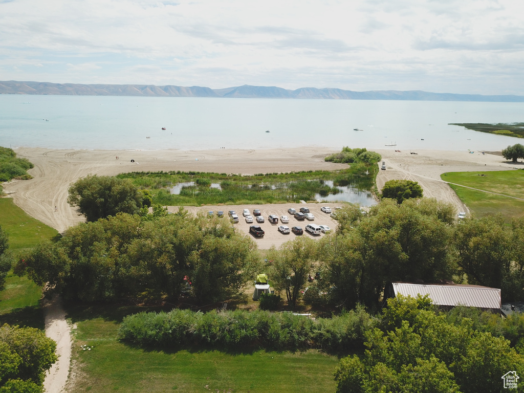 Drone / aerial view with a water and mountain view