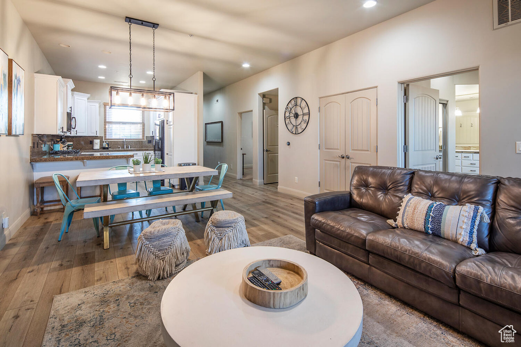 Living room with hardwood / wood-style floors