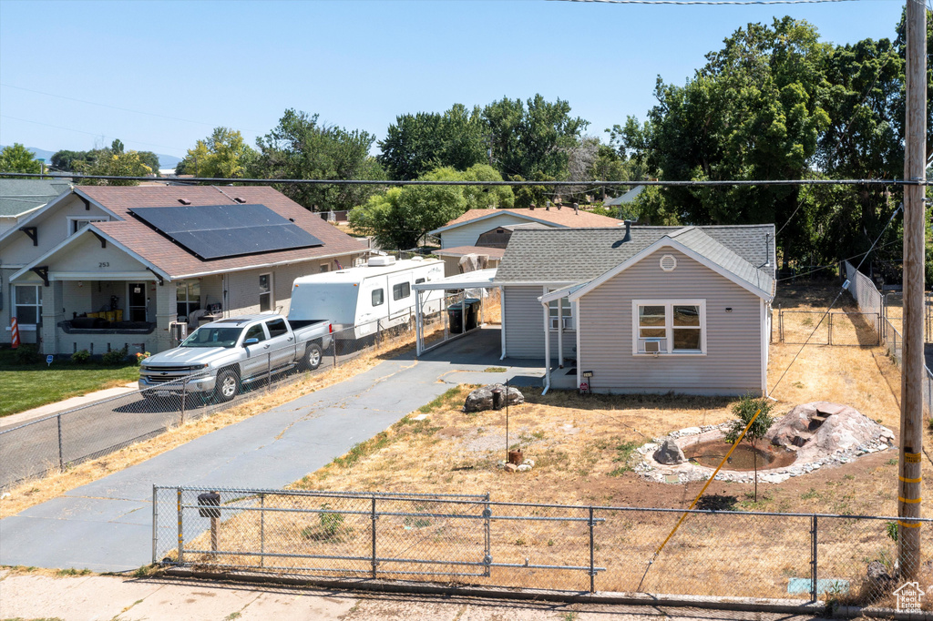 View of front of home featuring solar panels