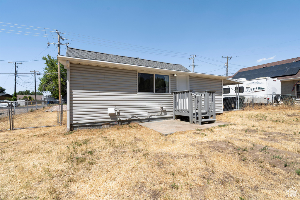 Rear view of property with a deck