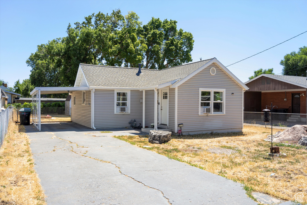 Single story home featuring a carport