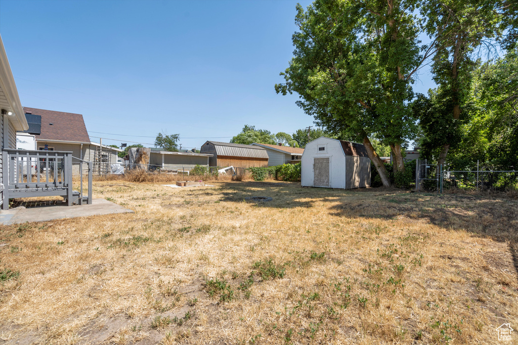 View of yard featuring a storage unit