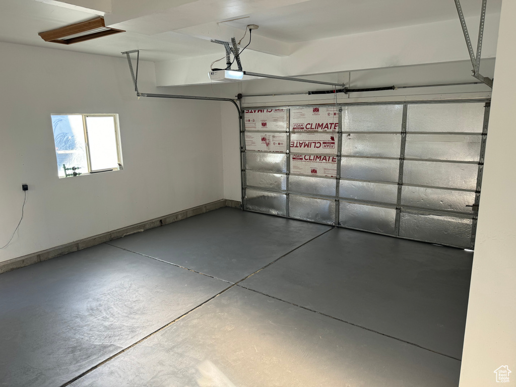 Garage featuring a garage door opener