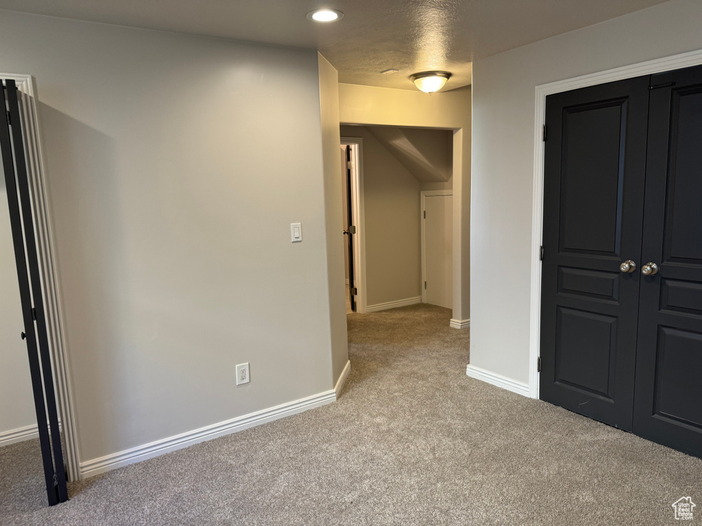 Unfurnished bedroom featuring carpet