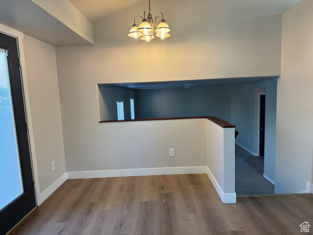 Interior space with a chandelier and hardwood / wood-style floors