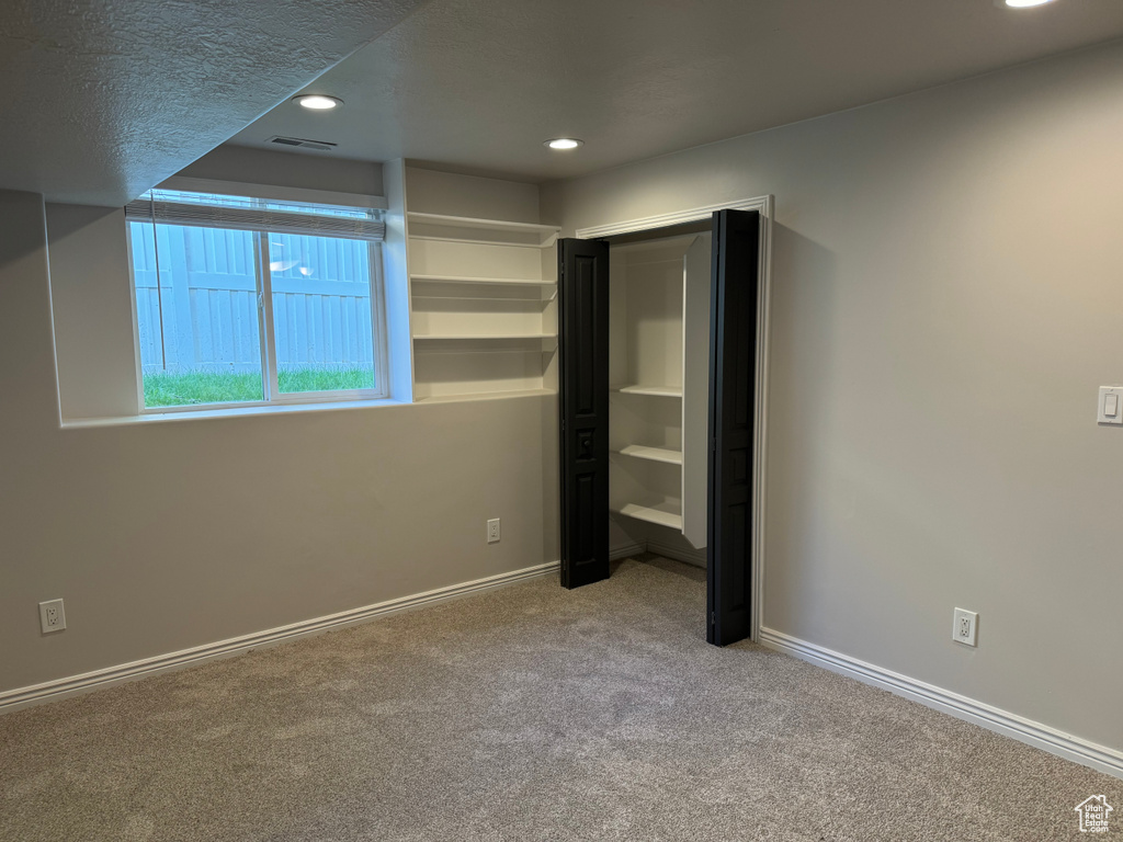 Unfurnished bedroom with carpet floors