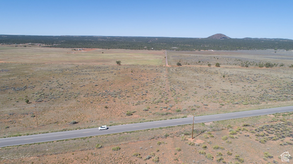 Birds eye view of property with a rural view