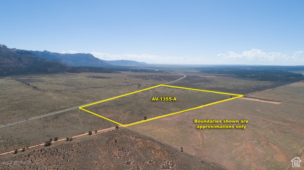 Birds eye view of property with a mountain view