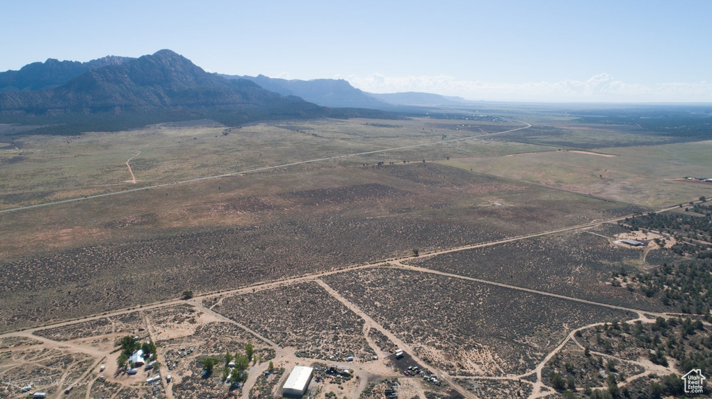 Birds eye view of property with a mountain view