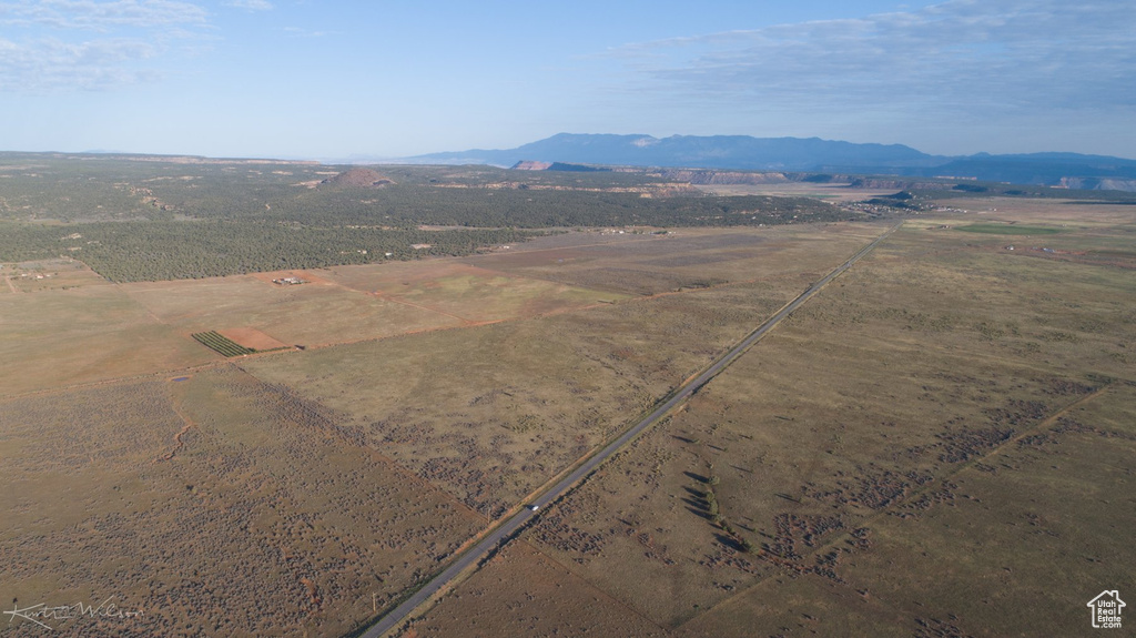 Birds eye view of property with a mountain view and a rural view