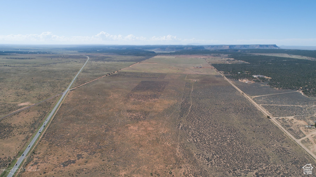 Birds eye view of property with a rural view