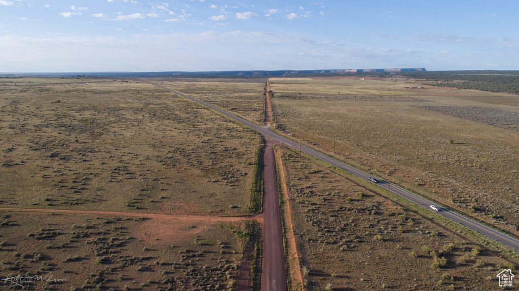 Birds eye view of property with a rural view