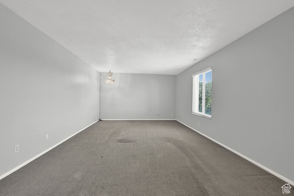 Empty room featuring carpet floors