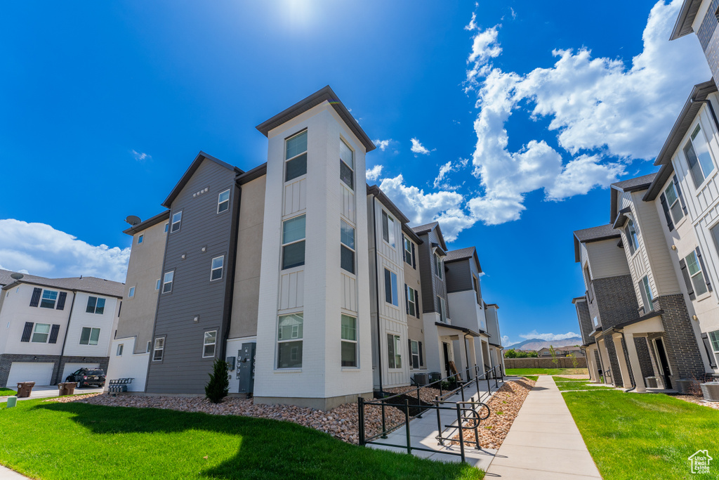 View of property with a residential view