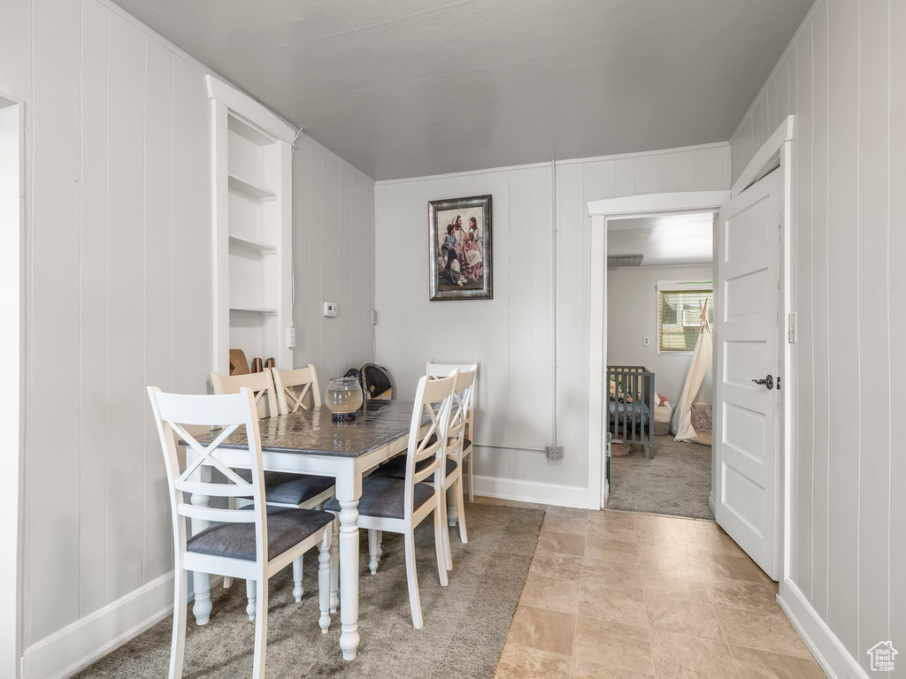 Dining area featuring light tile patterned floors