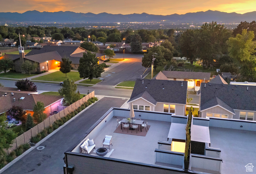 Aerial view at dusk featuring a mountain view