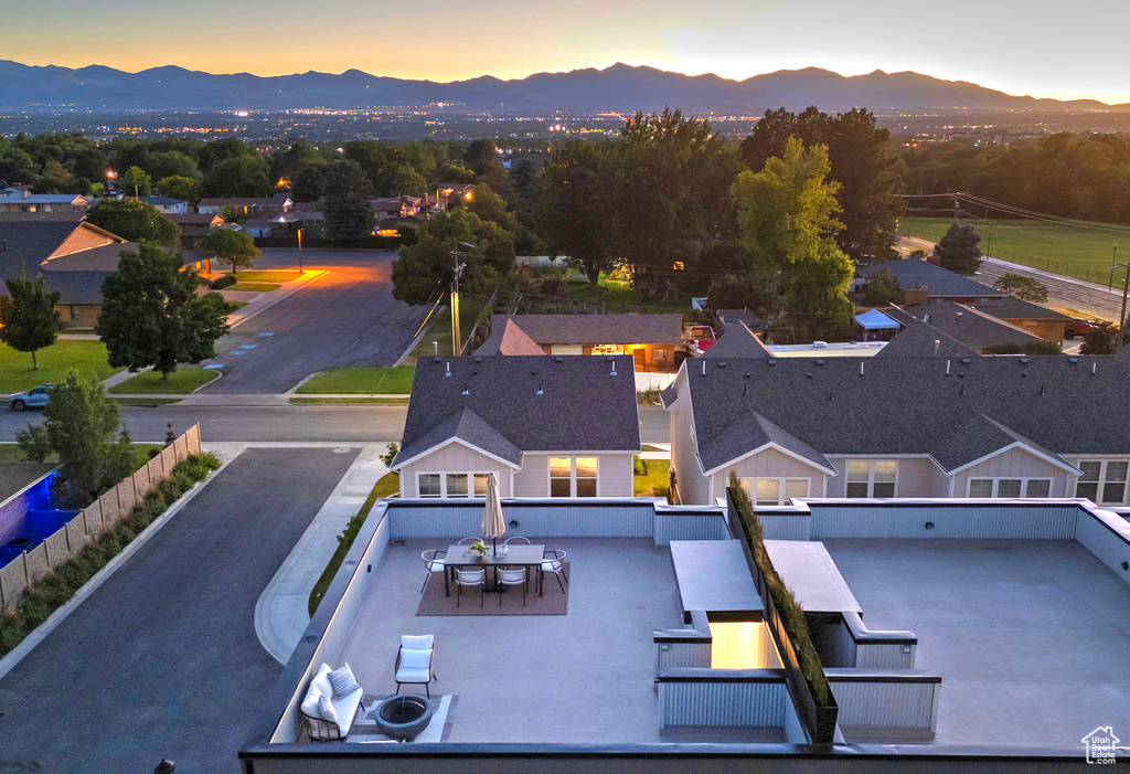 Aerial view at dusk featuring a mountain view