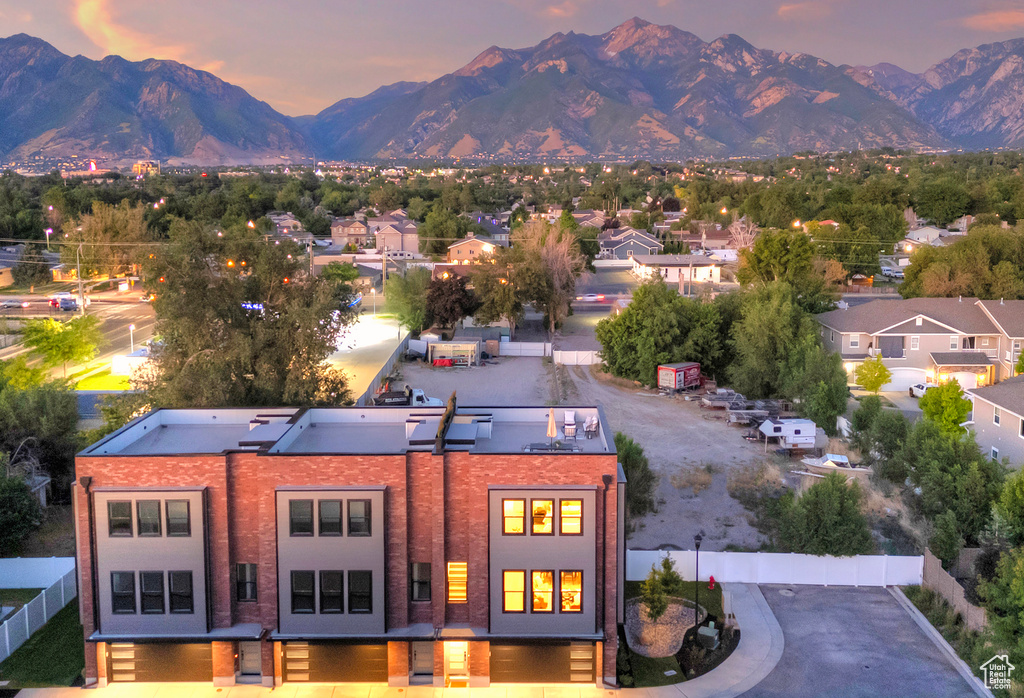 Aerial view at dusk featuring a mountain view