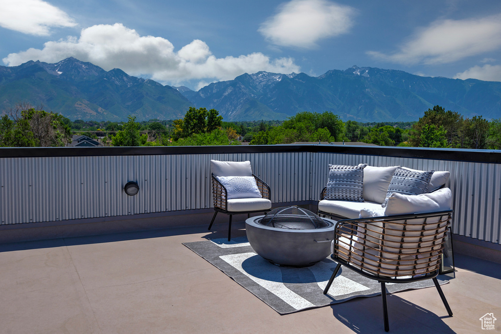 View of patio featuring a mountain view and a fire pit