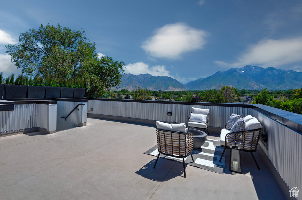 View of patio / terrace with a mountain view and an outdoor living space