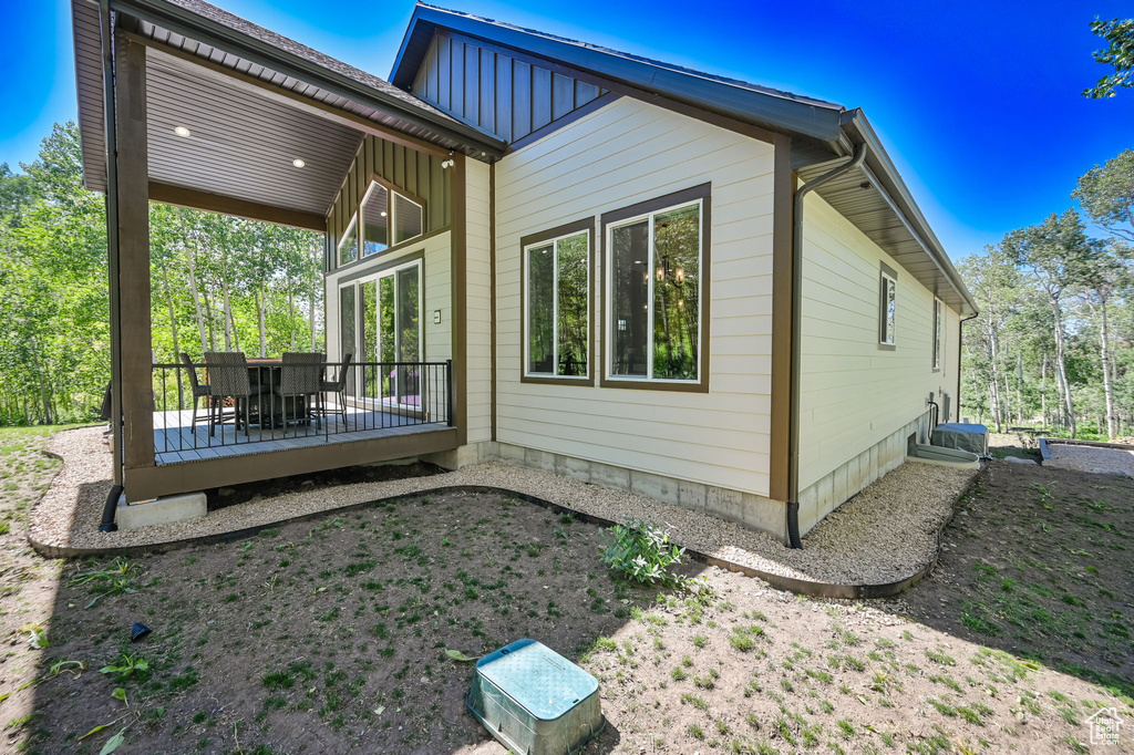 Rear view of property with a deck