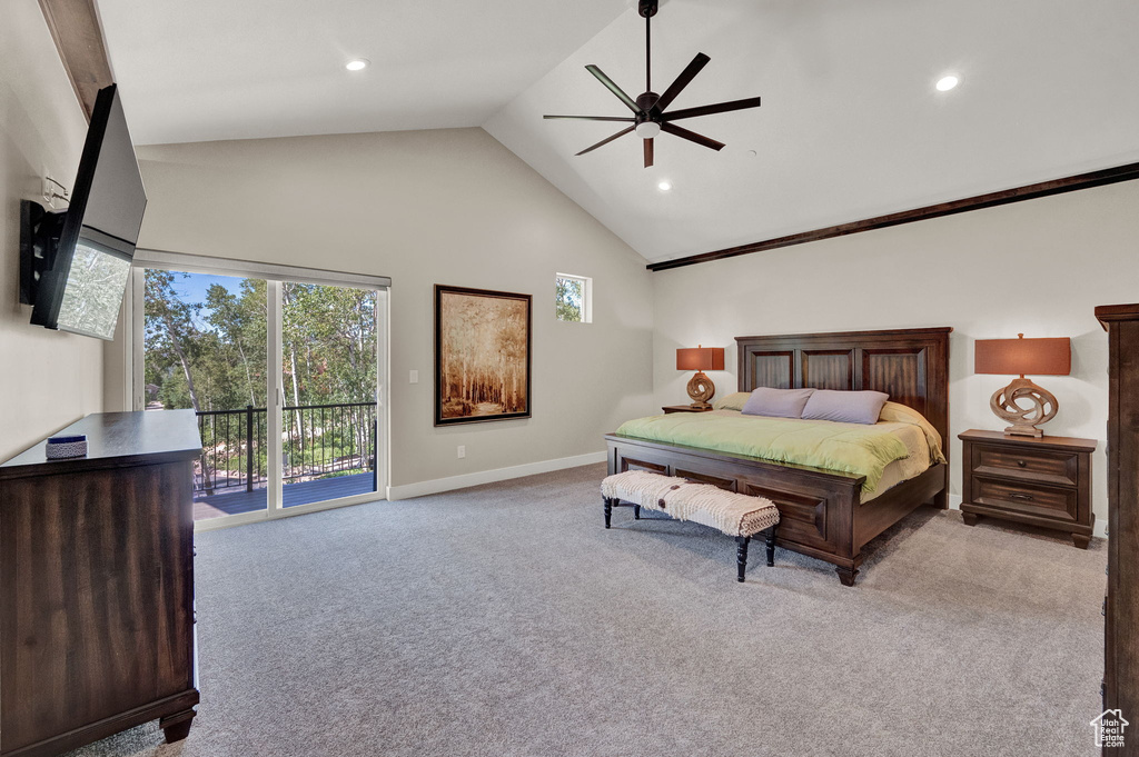 Carpeted bedroom featuring access to exterior and high vaulted ceiling