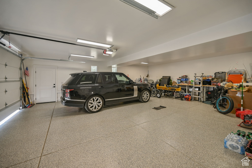 Garage featuring a garage door opener