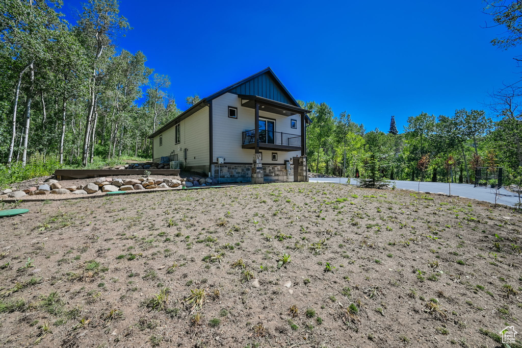 Rear view of property featuring a balcony