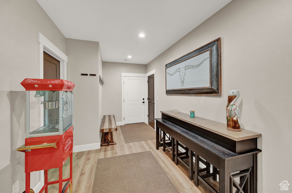 Corridor with light hardwood / wood-style floors