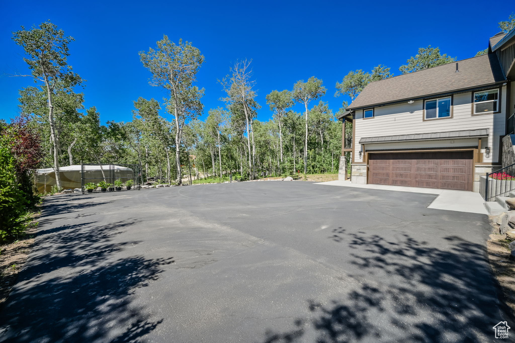 View of side of home with a garage