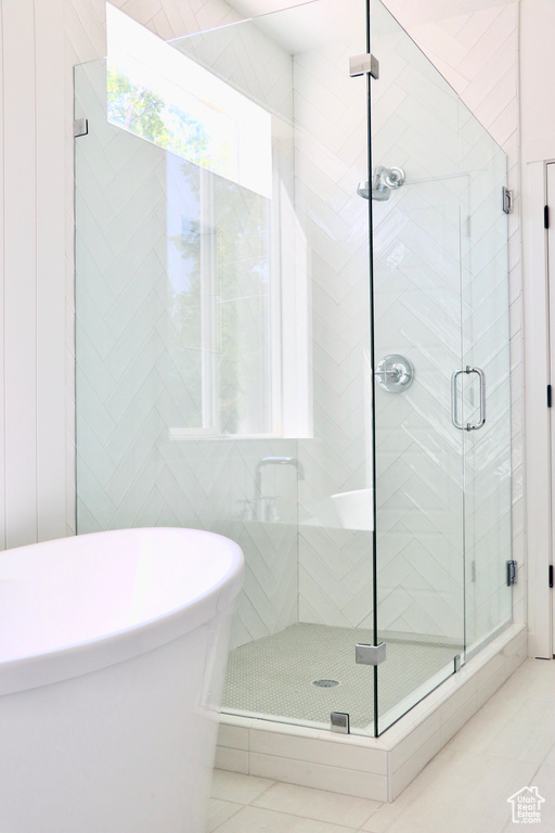 Bathroom with tile patterned flooring and walk in shower