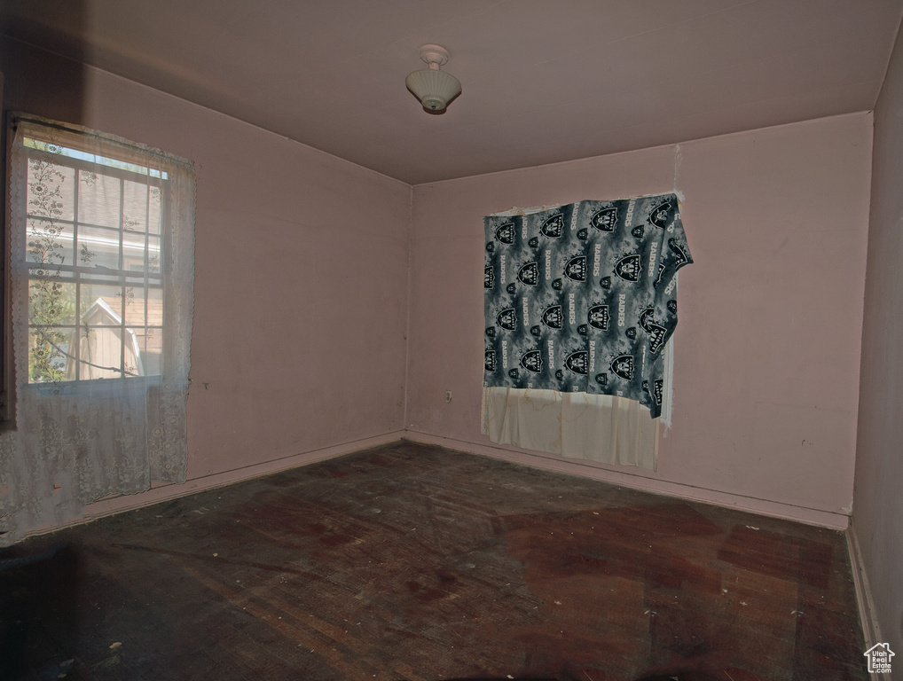 Unfurnished room with wood-type flooring