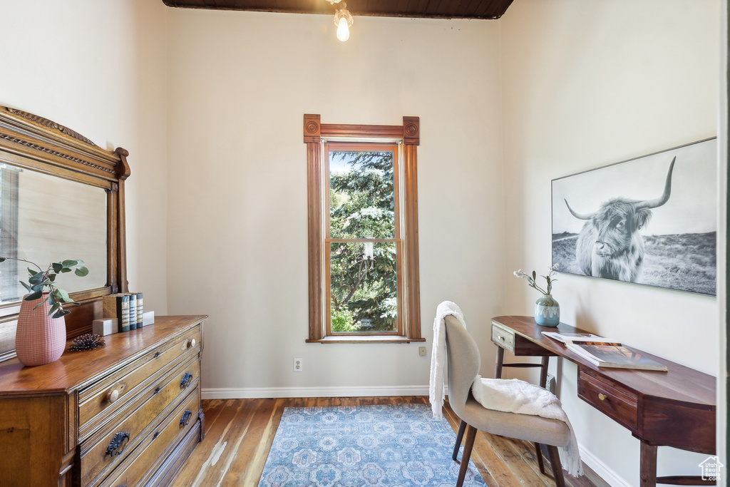 Office area with hardwood / wood-style floors