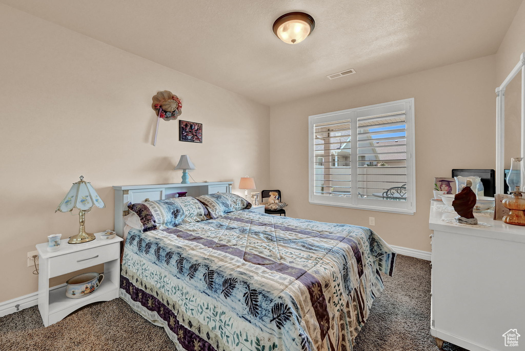 Bedroom featuring carpet flooring