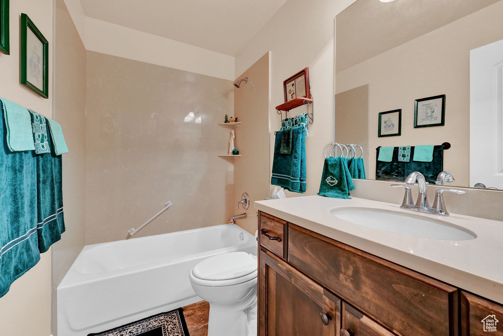 Full bathroom featuring tile patterned floors, vanity, tub / shower combination, and toilet