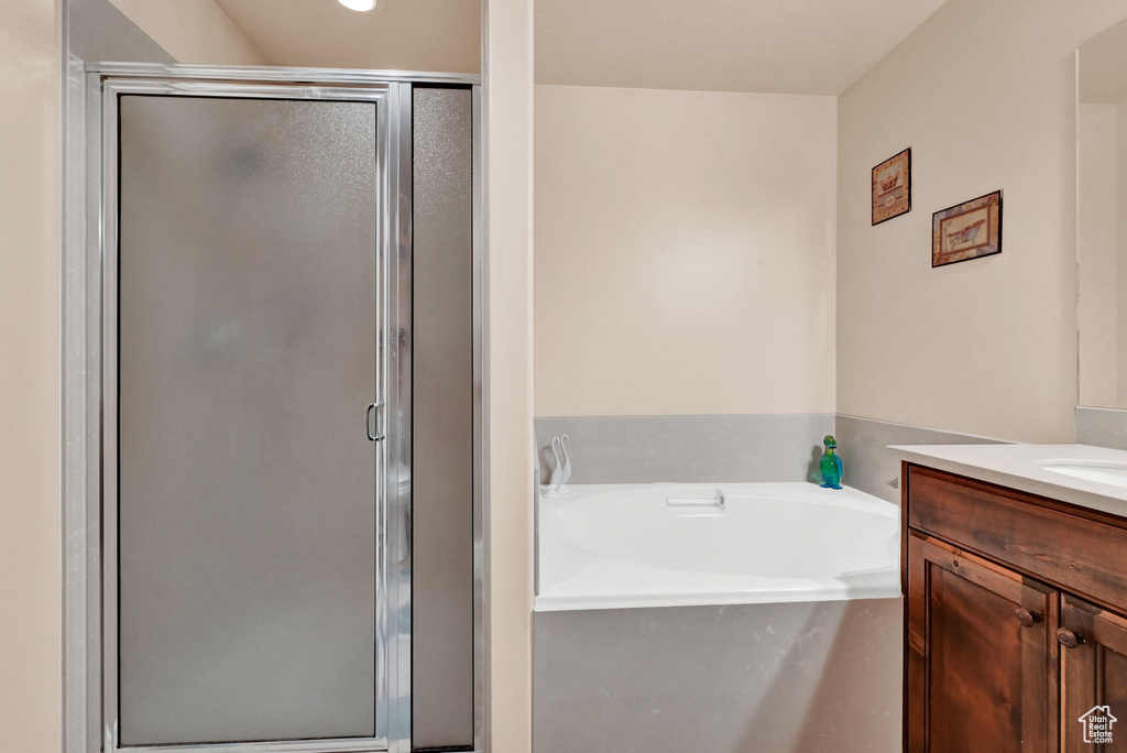 Bathroom with vanity and independent shower and bath