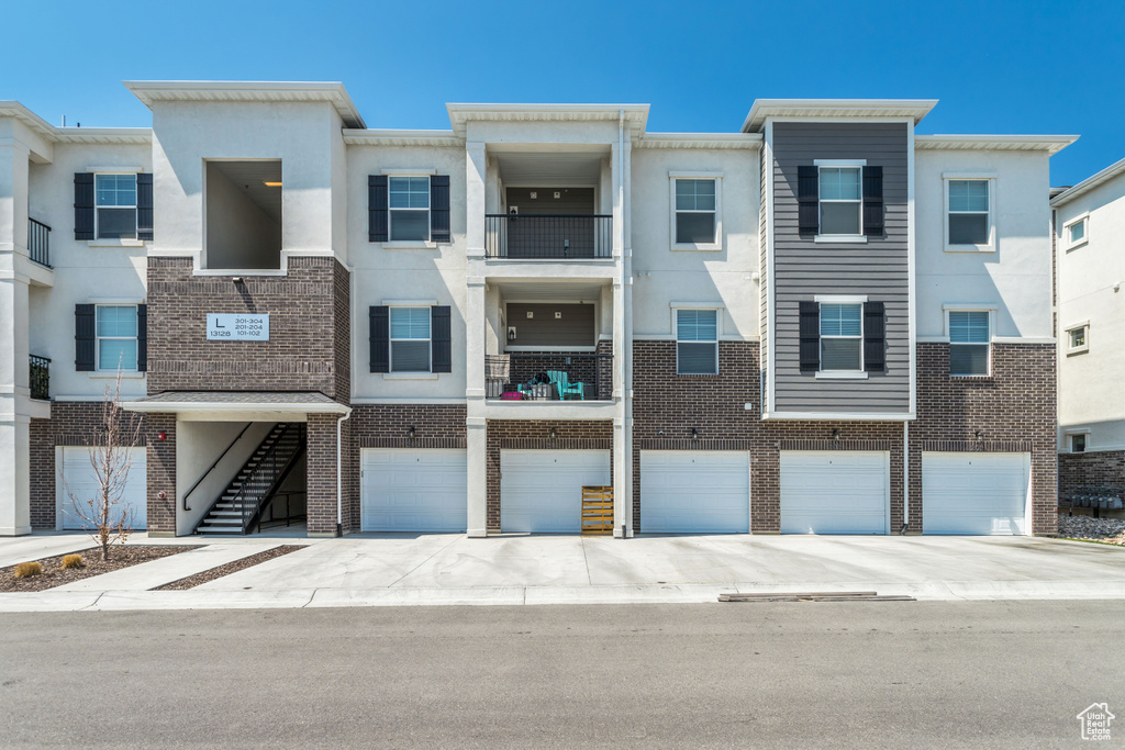 Multi unit property with a garage and a balcony