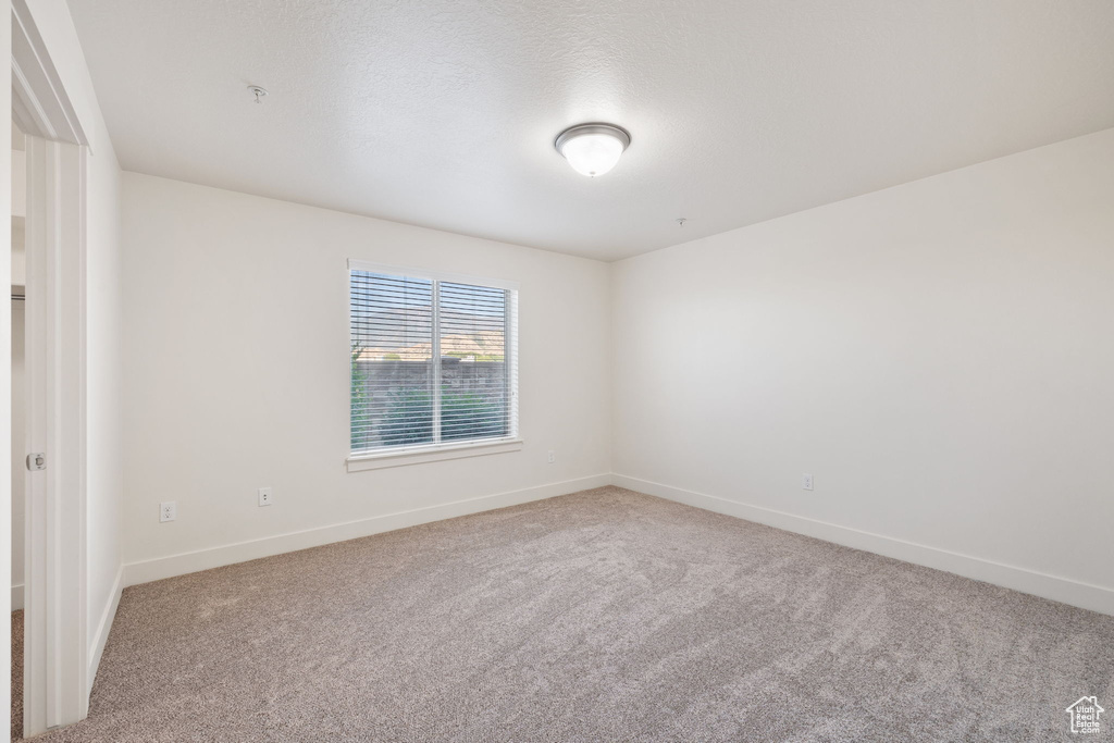 Empty room featuring carpet