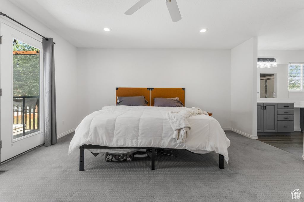 Bedroom with access to outside, ceiling fan, and hardwood / wood-style floors