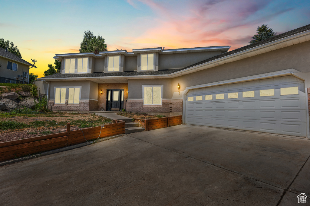 View of front of property with a garage