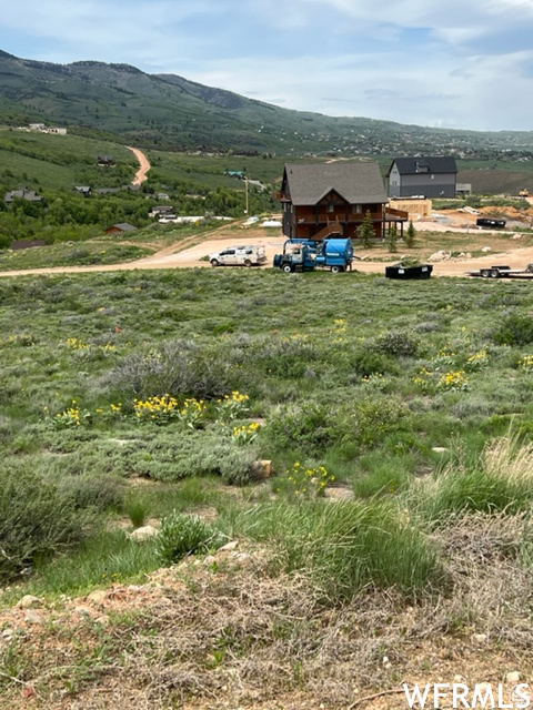 Property view of mountains featuring a rural view