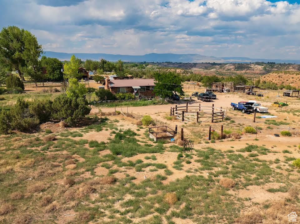 Drone / aerial view with a mountain view and a rural view