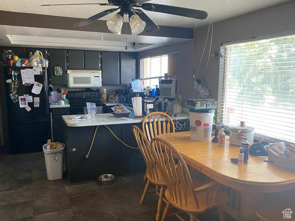 Tiled dining space with ceiling fan