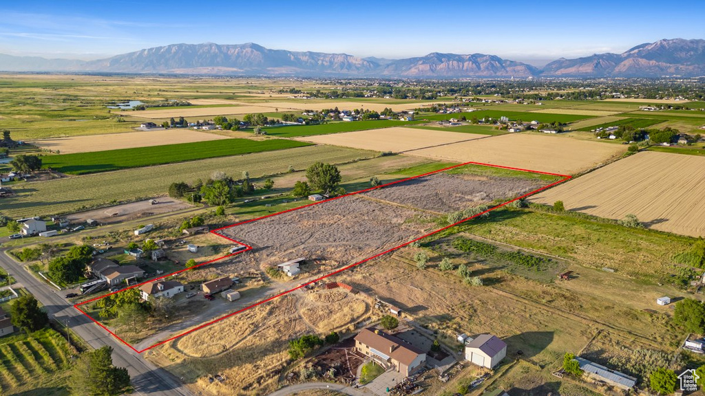 Birds eye view of property with a mountain view and a rural view