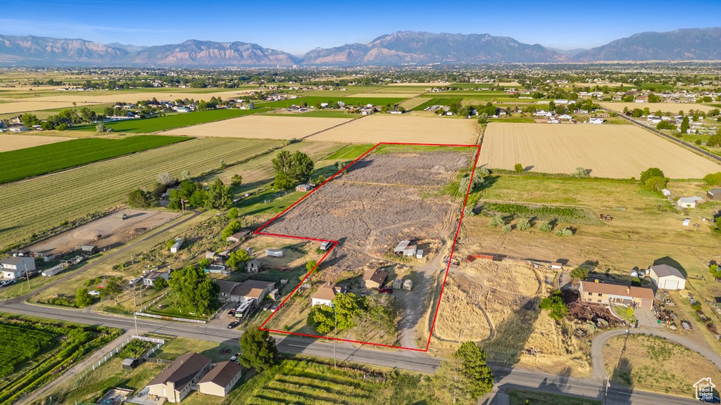 Birds eye view of property featuring a mountain view and a rural view