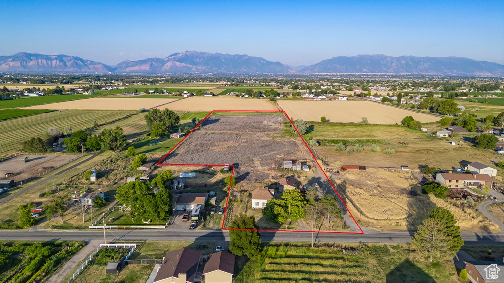 Birds eye view of property with a mountain view and a rural view