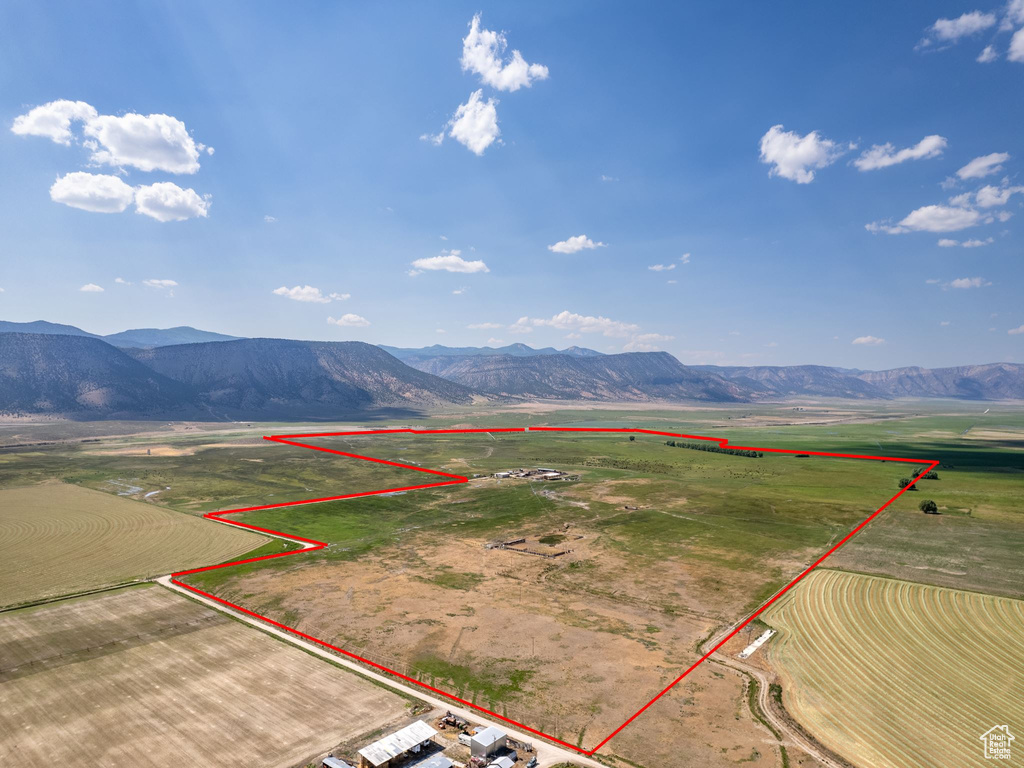 Birds eye view of property featuring a mountain view and a rural view