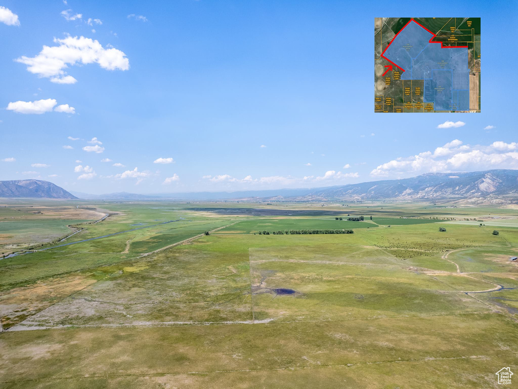 Birds eye view of property featuring a mountain view and a rural view