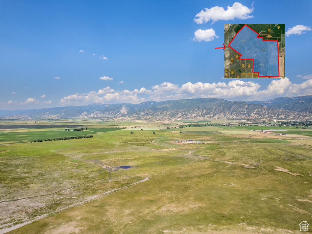 Property view of mountains with a rural view