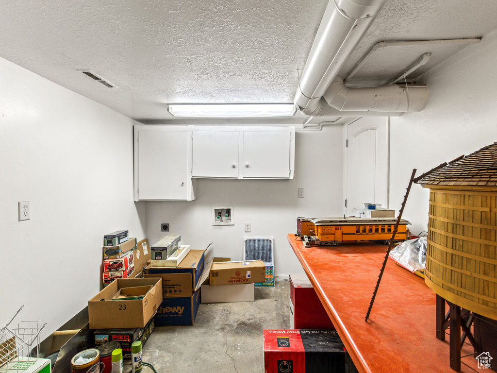 Interior space featuring a textured ceiling